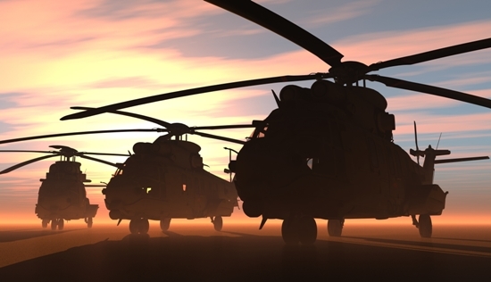 three helicopter silhouettes against a dawn sky