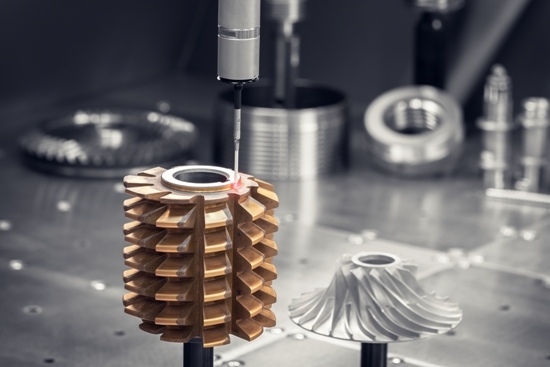 close up of a CNC machine turning precision pieces of metal parts